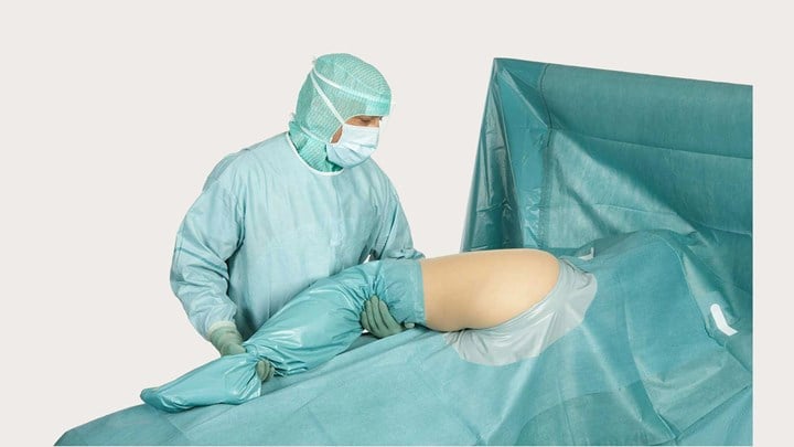 a surgeon using a BARRIER Orthopaedic drape